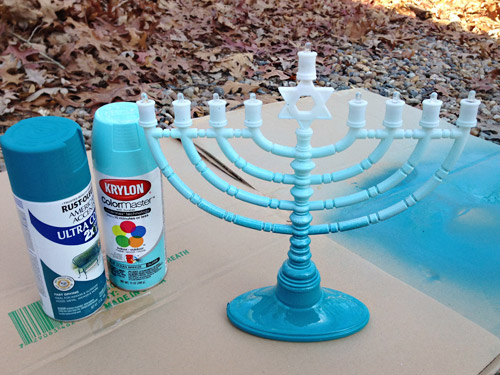 Two cans of blue spray paint for DIY Menorah painting holiday project for gradient effect