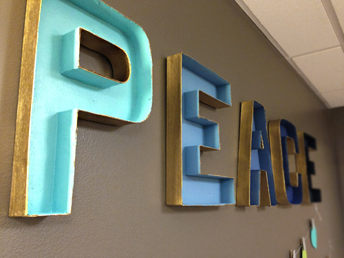 Finished cardboard craft letters painted in gradient for holiday decorations in Childrens Hospital of Richmond