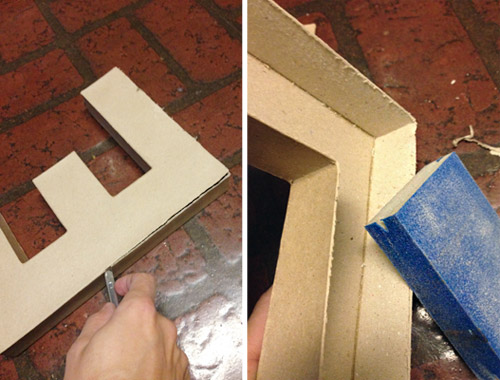 Cutitng cardboard letter with craft knife and sanding edge smooth