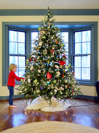 A Christmas tree overloaded with a hodgepodge of sentimental ornaments  accumulated over the years