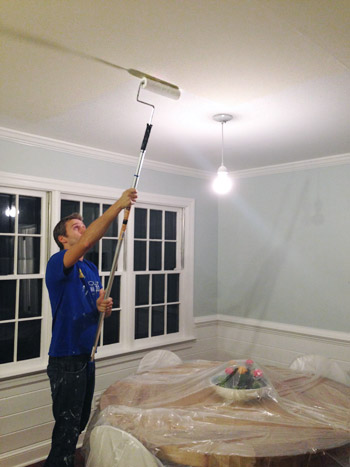 John painting ceiling with roller