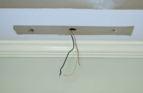 Wires sticking out of ceiling where fluorescent light fixture used to be