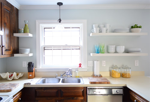 after photo of updated kitchen with white Ikea floating shelves