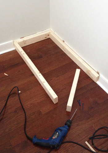 2x4 boards under base of Ikea Dresser