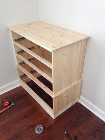 Ikea Fjell Dresser sitting on 2x4 base to raise it up