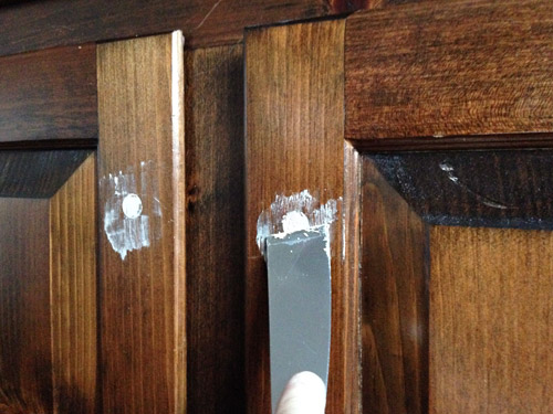 Wood filling old knobs holes in kitchen cabinets