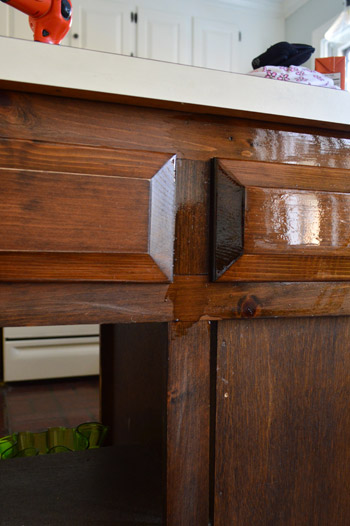 First coat of darker PolyShades stain  on wood cabinet frames