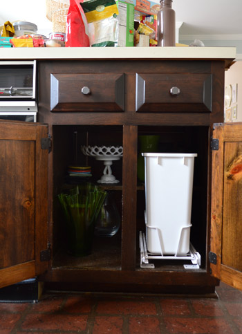 How to install a pull-out bin in a kitchen cupboard