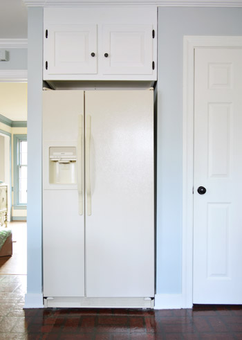 old yellow refrigerator before painting