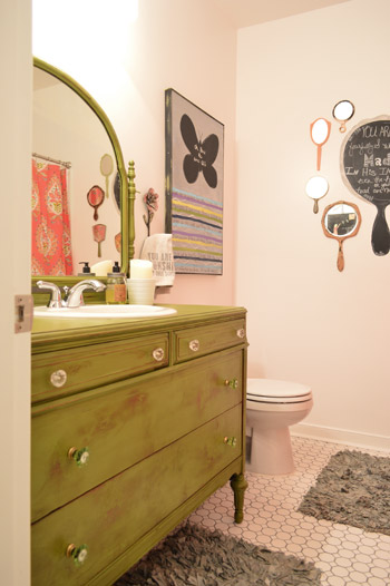 Farmhouse Green Bathroom Vanity With Collage of Mirrors On Wall