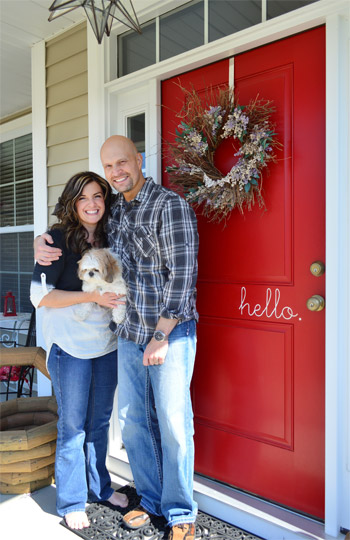Beck and Brian At Red Front Door With Wreath and Hello Decal