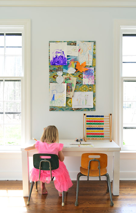 Daughter Coloring At Small Art Desk In Home Office