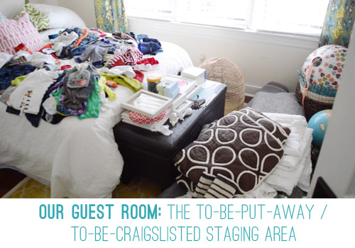 Guest Room Filled With Clothes and Items To Be Craigslisted