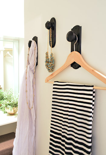 Clothes In Closet Hung From Decorative Vintage Doorknobs