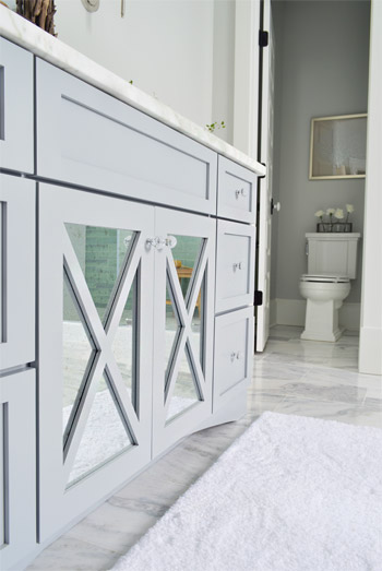 X Mirror Detail On Cabinet Doors Of Bathroom Vanity