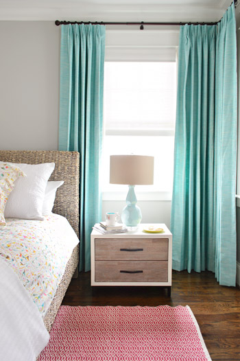 Colorful Bedroom With Aqua Blue Curtains and Pink Red Rug