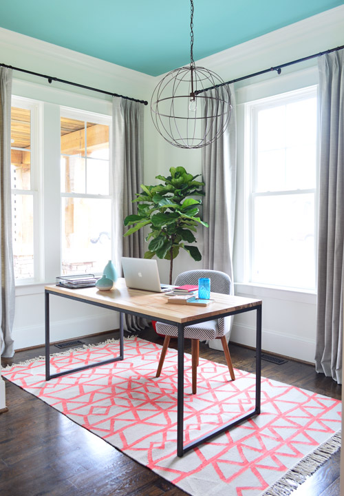 Modern Office With Skydive Blue Ceiling And Orange Rug With Floating Desk