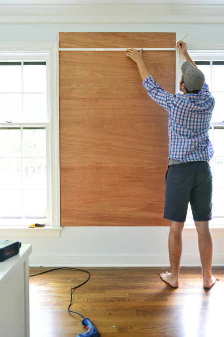 marking cut for top plywood piece for cork board wall so that it doesn't extend higher than the window frame