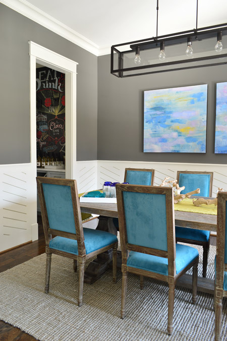 Upholstered Blue Dining Chairs In Modern Dining Room With Kendall Charcoal Walls