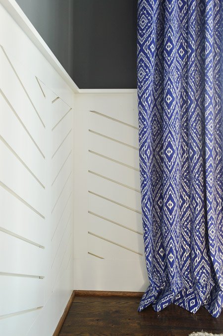 Detail of Chevron Wainscot In Dining Room With Blue Curtains