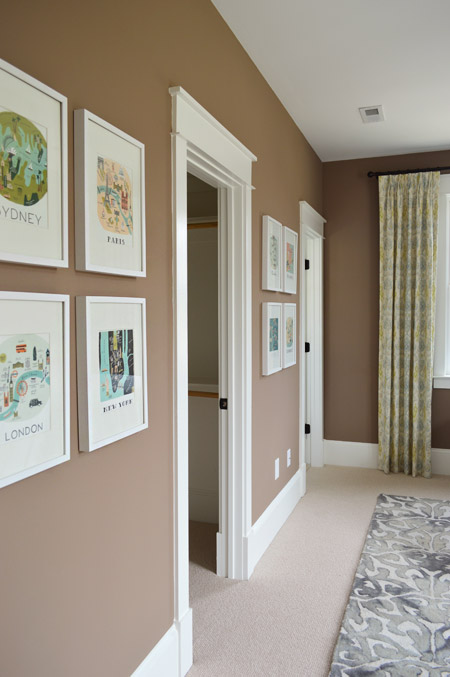 Frame Collage In Bedroom With Taupe Fedora Walls