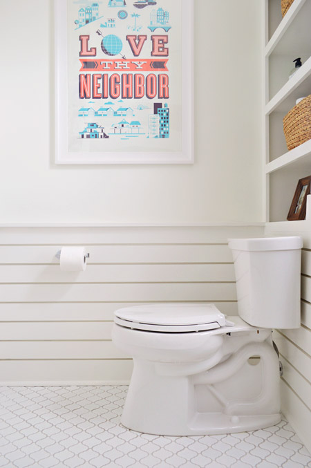 Slatted Wainscoting Bathroom With Help Ink Art Above Toilet