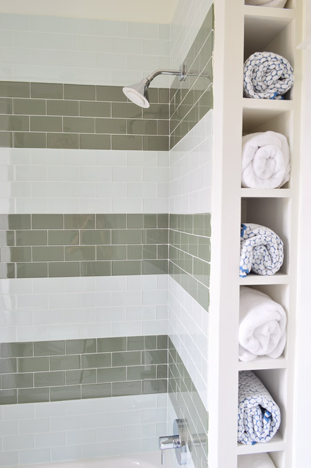 Towel Niche Built-In To Area Behind Striped Subway Tile Shower