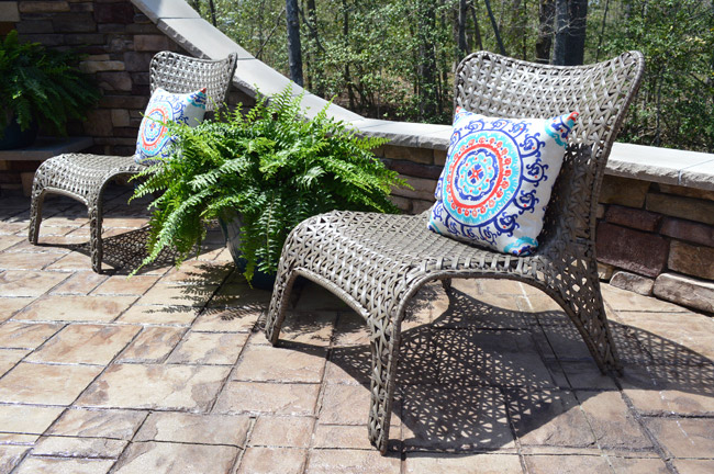 Wicker Lounge Chairs In Backyard Patio Of Show House