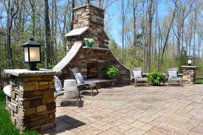 Large Stone Outdoor Fireplace Area At Show House Backyard Patio