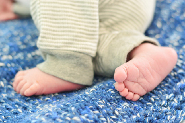 DIY Newborn Photo Of Infant Feet On Blue Blanket For Birth Announcement