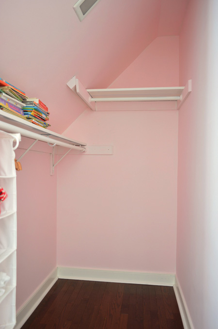 Pink Painted Walk-In Closet In Girl's Bedroom