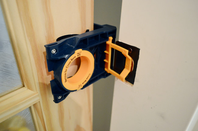 Ryobi Door Lockset Kit Clamped To Unfinished Door To Mark Location Of Knob And Strikeplate