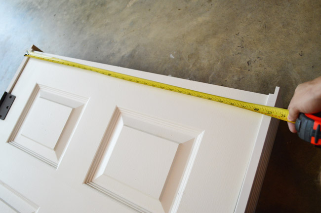 Tape Measuring Door For Jamb Length On Top Of Door